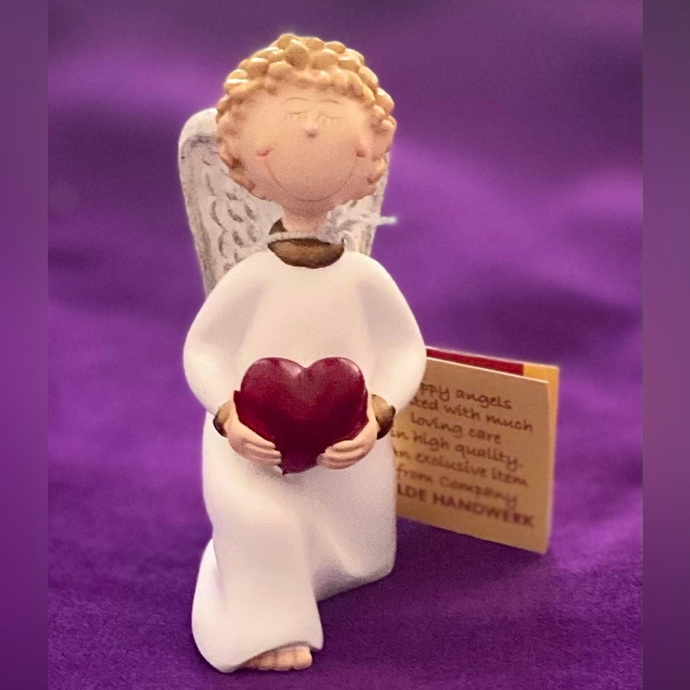 Gilde Angel Figurines and Ornaments. Item no: 28017. Kneeling boy holding heart.